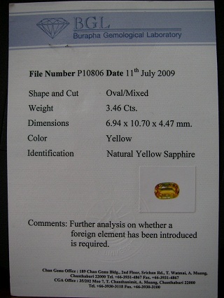 บุษราคัม yellow sapphire ใบเซอร์BGL-P10806 น้ำทองแม่โขง IF Oval/Mixed ขนาดพลอย 6.94 x 10.70 x 4.47 mm. size 3.46 ct.