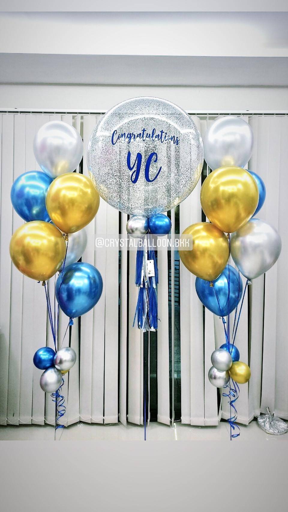ลูกโป่ง แสดงความยินดี Bubble ขนาด 24" Theme สีน้ำเงิน-ทอง พร้อม ช่อลูกโป่งโครเมี่ยม ช่อ 6 ลูก 2 ช่อ พร้อมตกเเต่ง สามารถเปลี่ยนสีลูกโป่ง/เปลี่ยนข้อความ/เปลี่ยนขนาดได้