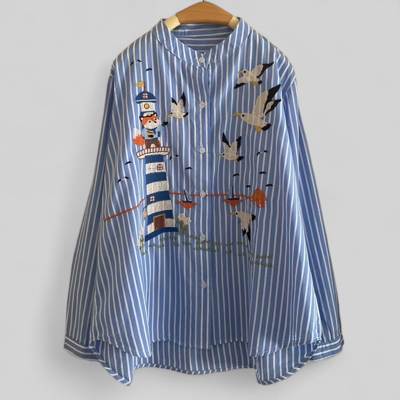 เสื้อผ้าฝ้ายลายทางปักลาย