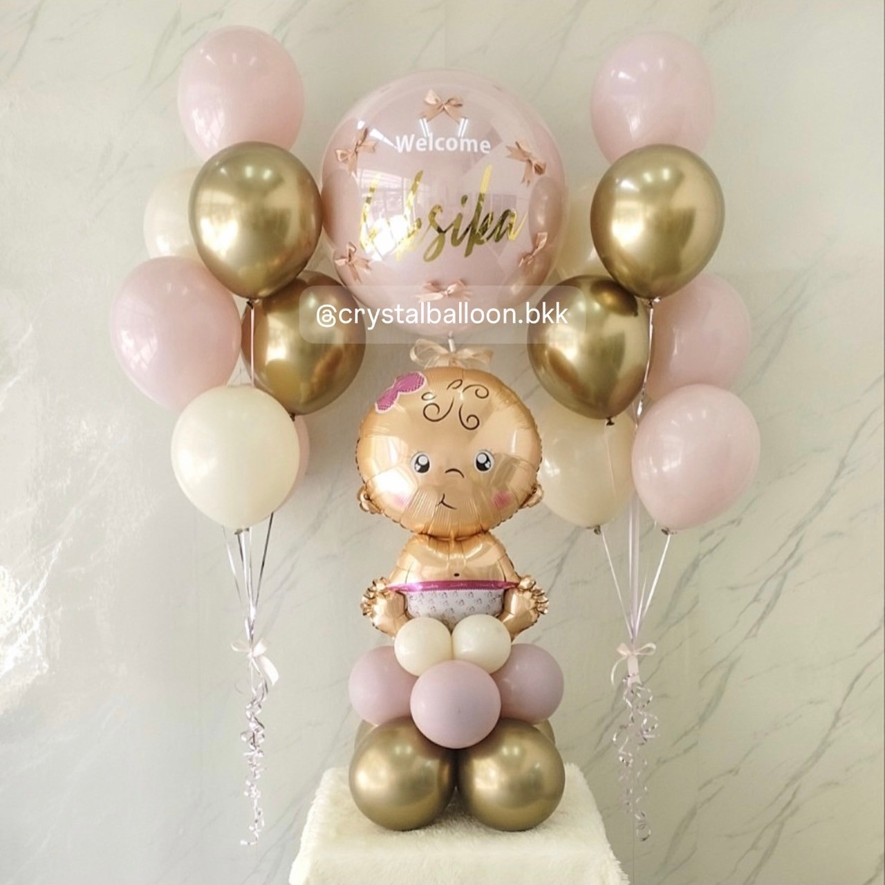 ลูกโป่ง Welcome Baby ฟอยล์เด็กผญ. ตั้งฐาน 1 ชิ้น ลูกโป่งยาง สี Dusk Pink 1 ลูก พร้อม ประดับโบว์จิ๋ว 6 ชิ้น ช่อ 7 ลูก 2 ช่อ สีคาเมเลียโครเมียม/Sand/Dusk Pink พร้อมตกแต่ง สามารถเปลี่ยนสีลูกโป่ง/เปลี่ยนฟอยล์ตกแต่งได้