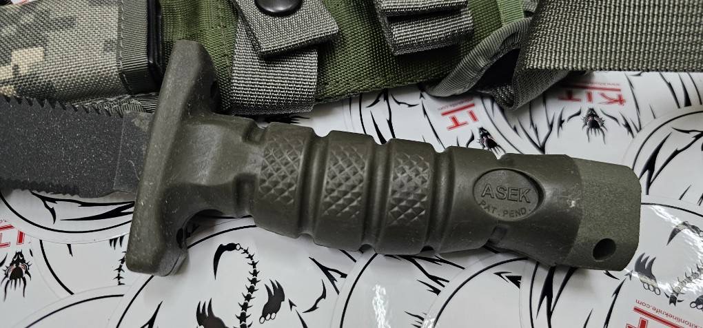 Ontario ASEK Survival Knife System FG/UC 5" Combo Blade, OD Green Rubber Handle, Strap Cutter, Digital Camo Sheath