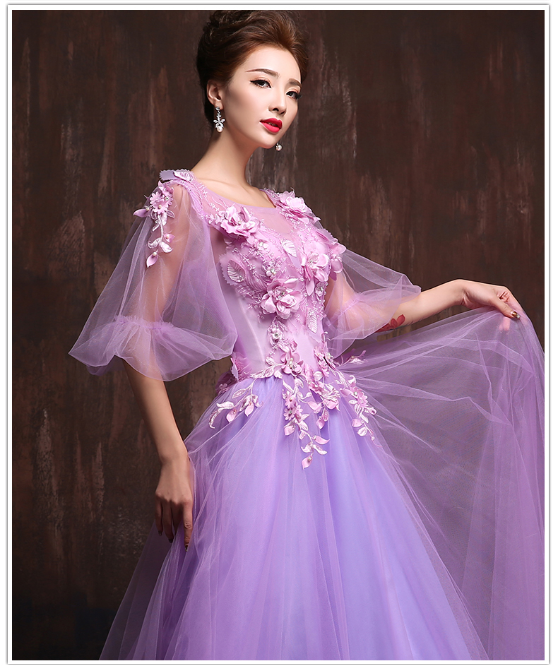 พร้อมเช่า ชุดแฟนซียาว แบบแขนยาว จั๊มปลายแขนน่ารักมาก เนื้อผ้าเป็นตาข่ายแบบซีทรู แต่งดอกและลูกปัด สีม่วง (ซิปหลัง)