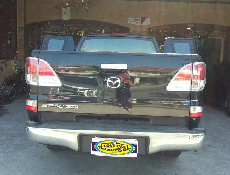 ขายพรมปูพื้นรถยนต์เข้ารูป Mazda BT 50 Cab ลายธนูสีดำขอบแดง