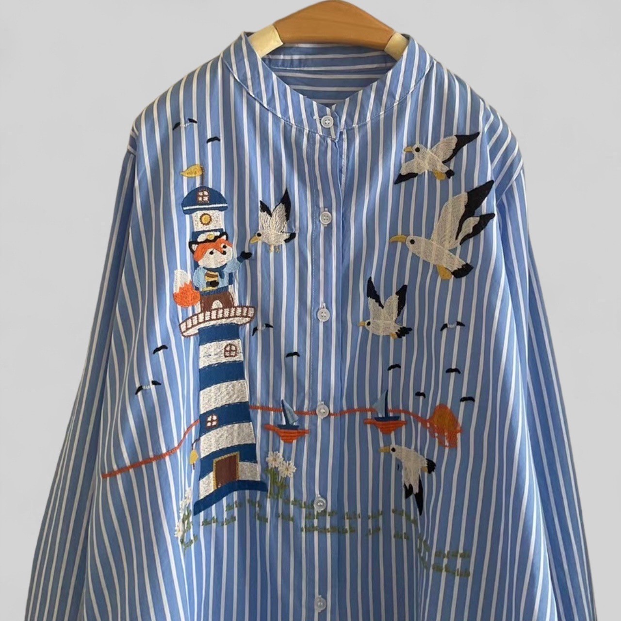 เสื้อผ้าฝ้ายลายทางปักลาย