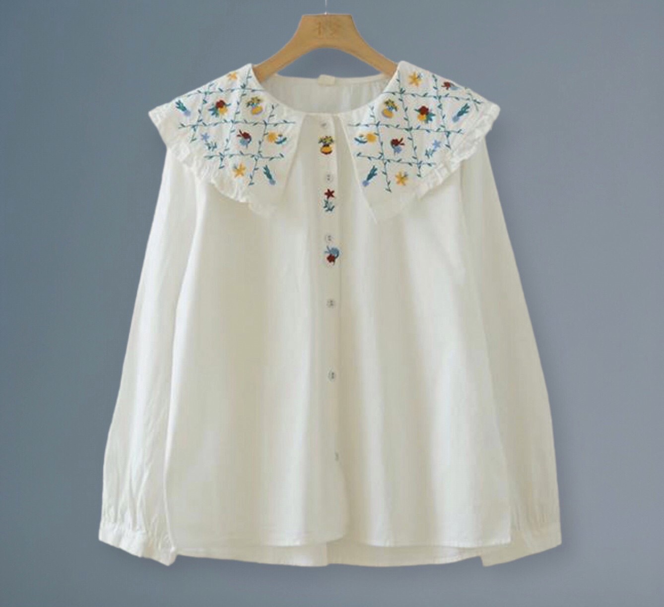 เสื้อผ้าฝ้ายแต่งปกลายปัก