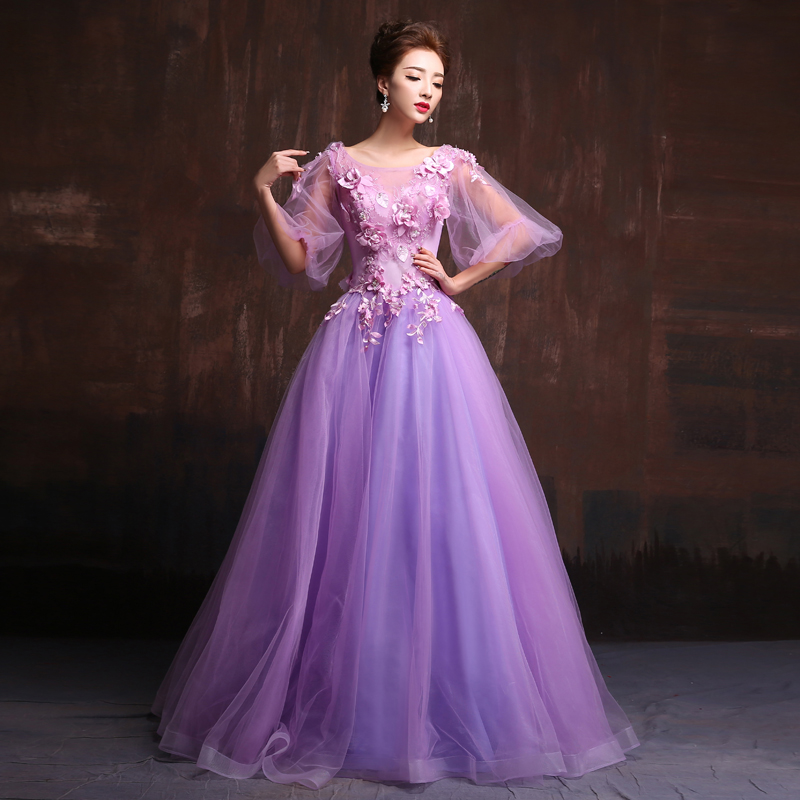 พร้อมเช่า ชุดแฟนซียาว แบบแขนยาว จั๊มปลายแขนน่ารักมาก เนื้อผ้าเป็นตาข่ายแบบซีทรู แต่งดอกและลูกปัด สีม่วง (ซิปหลัง)