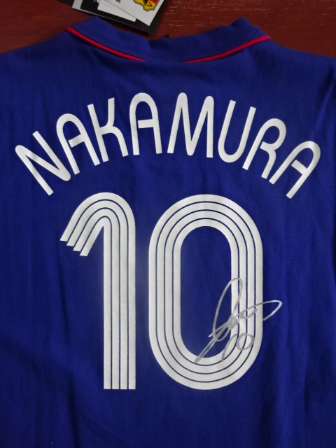 เสื้อที-เชิ๊ต (เสื้อยืดคอกลม) ฟุตบอล ทีมชาติญี่ปุ่น ชุดที่ระลึก ฟุตบอลโลก 2006 พร้อมติดชื่อและเบอร์ #10 นากามูระ ใหม่ MB-Size / JAPAN Football T-Shirt Souvenir Kit FIFA WORLD CUP 2006 with #10 NAKAMURA Printing Jersey NEW MB-Size