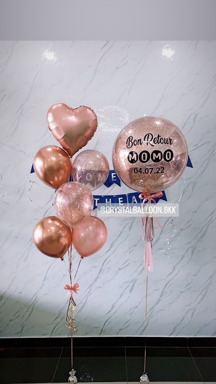 ลูกโป่ง Welcome Home Bubble ขนาด 24" สีโรสโกล พร้อม ช่อลูกโป่งฟอยล์หัวใจ ขนาด 18" 1 ช่อ พร้อมตกแต่ง ป้ายธง 21 ตัวอักษร สามารถเปลี่ยนสีลูกโป่ง/เปลี่ยนข้อความ/เปลี่ยนขนาดได้