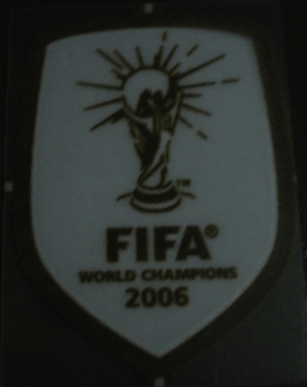 อาร์มสัญลักษณ์ฟุตบอล การแข่งขันฟุตบอลโลก - แชมป์ฟุตบอลโลก 2006 PLAYER SIZE ใหม่ / WORLD CUP International Football Tournament PLAYER SIZE Football Patch/Badge - FIFA WORLD CUP CHAMPIONS 2006 NEW