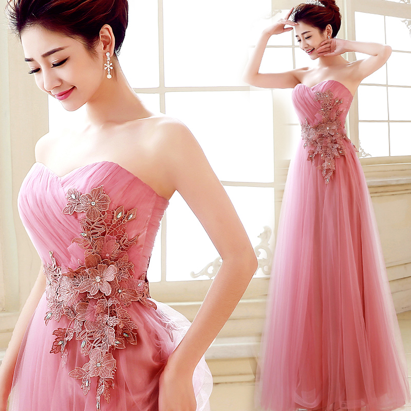 พร้อมเช่า ชุดราตรียาว เกาะอก สีชมพูหวาน ผ้าตาข่ายทั้งชุด อกจับจีบ แต่งดอกคาดเอว & พร้อมเม็ดคริสตัลหรู