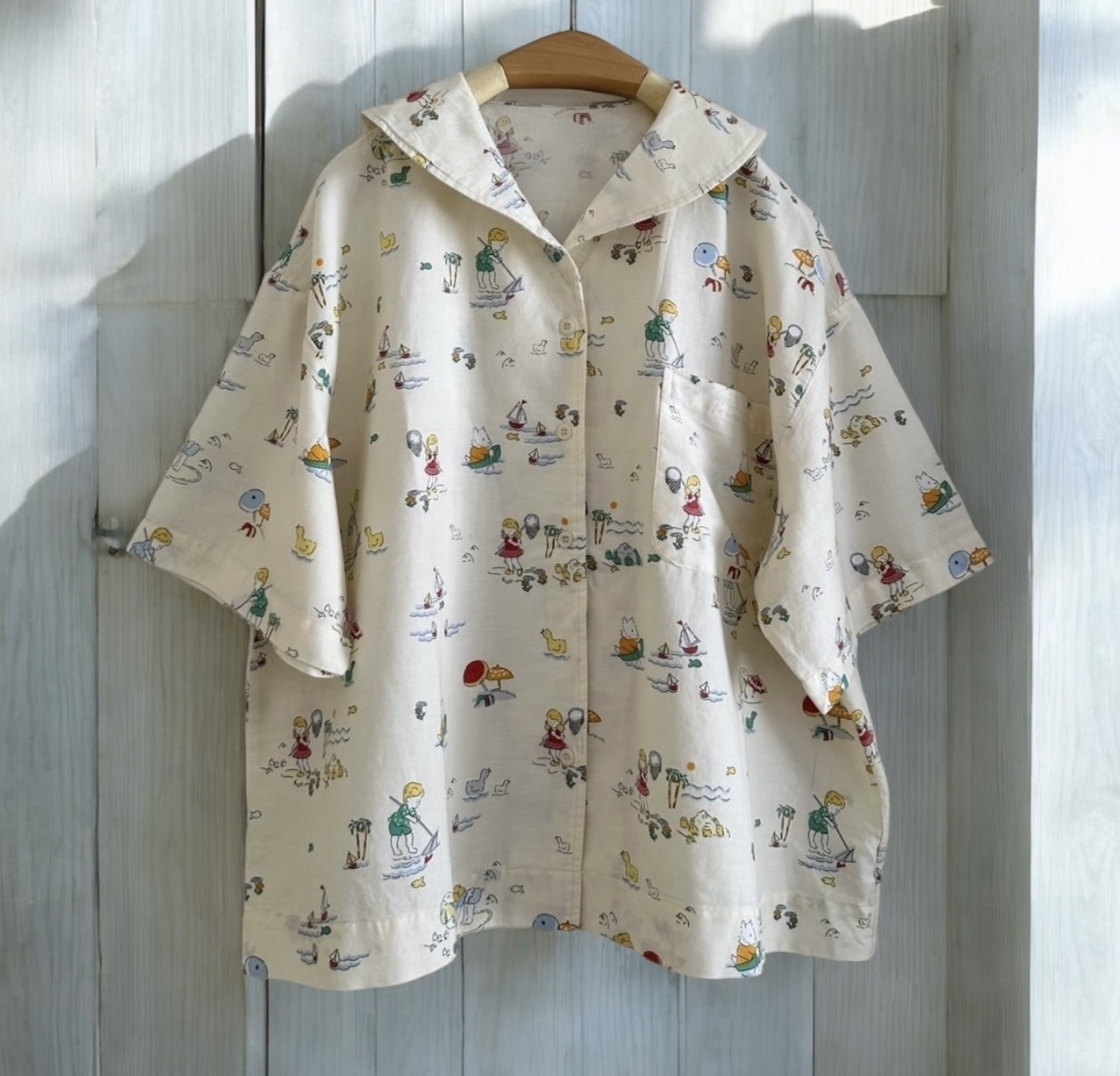 เสื้อคอวีผ้าฝ้ายลายพิมพ์น่ารักๆแต่งกระเป๋า