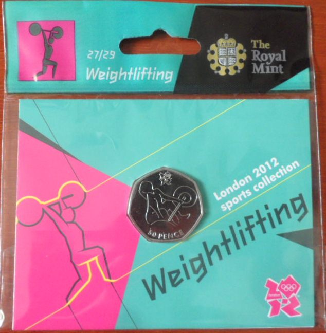 เหรียญที่ระลึก การแข่งขันกีฬาโอลิมปิก - โอลิมปิก ลอนดอน 2012; THE ROYAL MINT ชนิด 50 เพนซ์ ลายยกน้ำหนัก ใหม่ / OLYMPICS International Sports Tournament Souvenir Coin - OLYMPICS LONDON 2012; THE ROYAL MINT 50 Pence WEIGHTLIFTING NEW