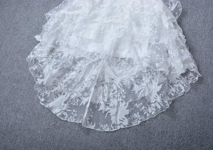 Pre-order เดรสขาว พรีเวดดิ้ง หน้าสั้นหลังยาว แขนกุด ลายดอกไม้ เรียบหรู