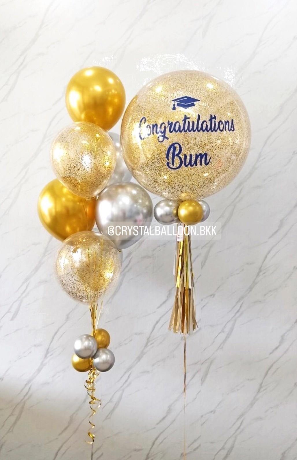 สั่ง ลูกโป่ง รับปริญญา Bubble ขนาด 24" กลิตตเตอร์สีทอง พร้อม ช่อลูกโป่งโครเมี่ยม ช่อ 7 ลูก 1 ช่อ,ลูกโป่งใส ใส่กลิตเตอร์ พร้อมตกเเต่ง สามารถเปลี่ยนสีลูกโป่ง/เปลี่ยนข้อความ/เปลี่ยนขนาดได้