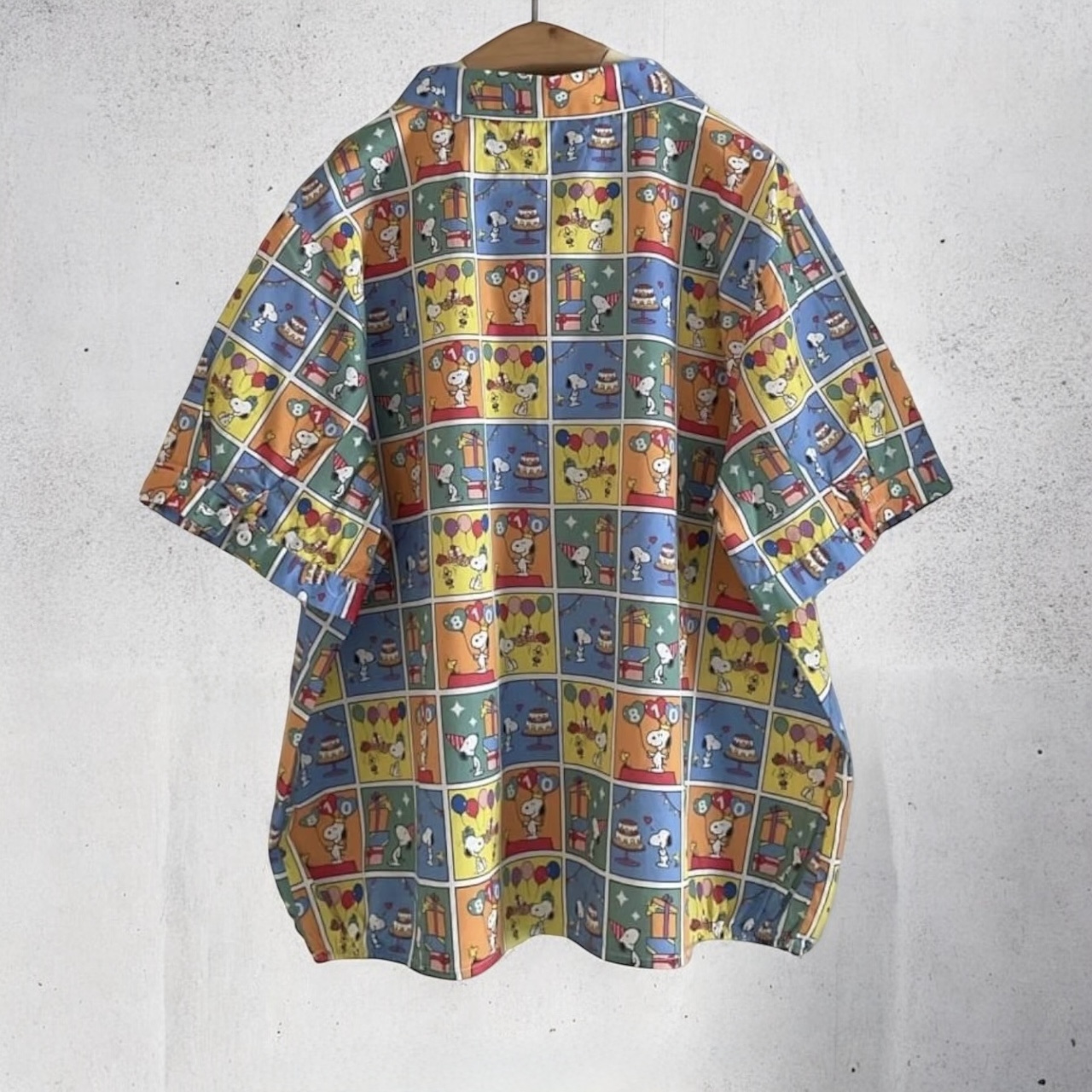 เสื้อผ้าฝ้ายลายพิมพ์แต่งกระเป๋า