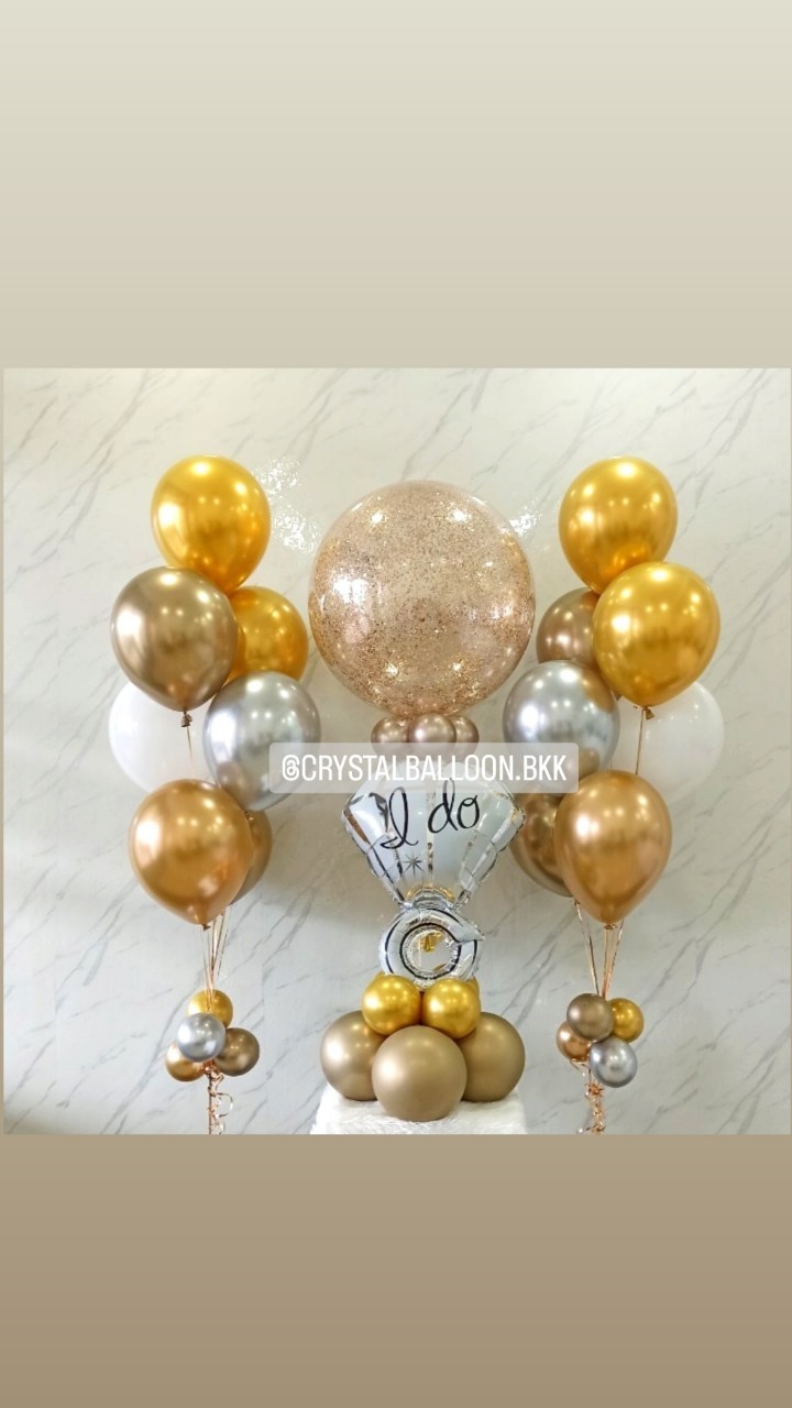ลูกโป่ง ขอแต่งงาน Bubble ขนาด 24" กลิตเตอร์สีแชมเปญ 1 ลูก พร้อม ช่อลูกโป่งสีโครเมี่ยม ช่อ 7 ลูก 2 ช่อ,ฟอยล์แหวนเดี่ยว ตั้งฐาน 1 ชิ้น พร้อมตกแต่ง สามารถเปลี่ยนสีลูกโป่ง/เปลี่ยนข้อความ/เปลี่ยนฟอยล์ตกแต่ง/เปลี่ยนขนาดได้