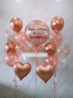 ลูกโป่ง วันครบรอบ Bubble ขนาด 24" สีโรสโกล พร้อม ช่อลูกโป่ง 7 ลูก 2 ช่อ พร้อมตกแต่ง ป้ายธง 16 ตัวอักษร,ฟอยล์หัวใจ ขนาด 18" ตั้งพื้น 2 ชิ้น สามารถเปลี่ยนสีลูกโป่ง/เปลี่ยนข้อความ/เปลี่ยนขนาด/เปลี่ยนสี-ป้ายธง/เปลี่ยนฟอยล์ตกแต่งได้
