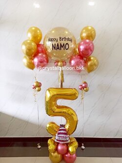 ลูกโป่ง วันเกิด Bubble ขนาด 24" สีกลิตเตอร์ทอง พร้อม ช่อลูกโป่ง ช่อ 5 ลูก 2 ช่อ ฟอยล์ตัวเลข ขนาด 40" สีทอง ตั้งฐาน 1 ชิ้น Theme ชมพู - ทอง พร้อมตกแต่ง สามารถเปลี่ยนสีลูกโป่ง/เปลี่ยนข้อความ/เปลี่ยนขนาดไ