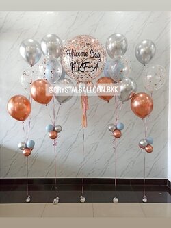 ลูกโป่ง Welcome Baby Bubble ขนาด 24" Confetti สีโรสโกลด์ พร้อมตกแต่ง ช่อลูกโป่งโครเมี่ยม 5 ลูก 2 ช่อ พร้อมตกแต่ง ช่อลูกโป่ง 3 ลูก 2 ช่อ สามารถเปลี่ยนสีลูกโป่ง/เปลี่ยนข้อความ/เปลี่ยนขนาดได้