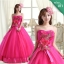 พร้อมเช่า ชุดแฟนซี ชุดราตรี เกาะอก สีชมพู Hot pink แต่งช่อดอกไม้ช่วงหน้าอก