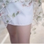 Pre-order เดรสขาว พรีเวดดิ้ง หน้าสั้นหลังยาว แขนกุด ลายดอกไม้เขียว เรียบหรู
